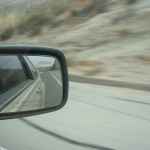 close up of rearview window on a moving car