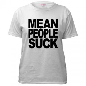 White t-shirt with text that says Mean People Suck