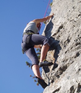 Woman rockclimbing outdoors