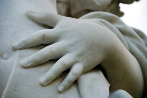 close up of hand of marble statue
