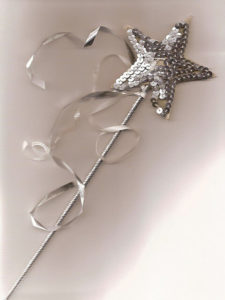 child's silver sequined star wand with silver ribbons