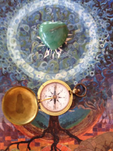 abstract art piece with tree, pocket watch, and heart-shaped pendant