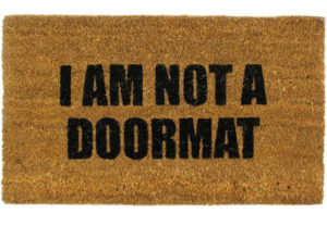 brown doormat with text that says "I am not a doormat"