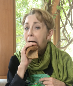 Martha Beck eating a piece of bread