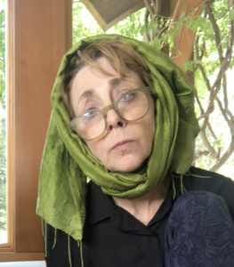 Martha Beck with green scarf wrapped around her head