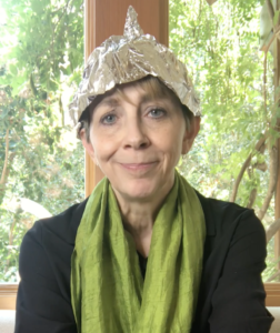 Martha Beck in green scarf and tinfoil hat